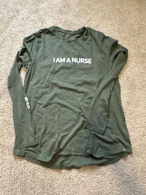 FIGS Olive Geee  Long Sleeve Tee with White "I AM A NURSE" Text